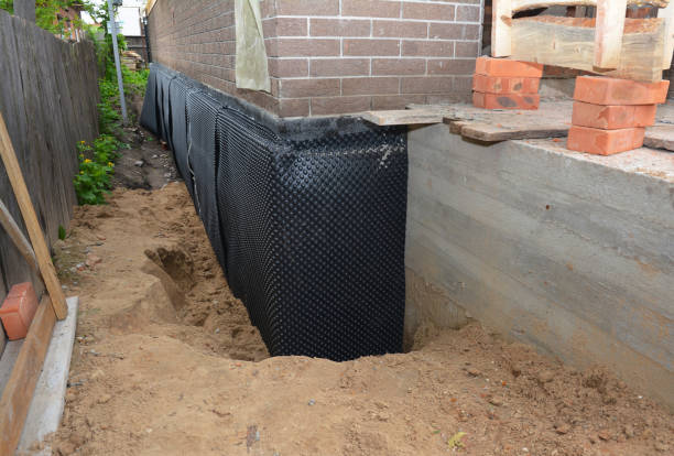 Happy homeowners after waterproofing job in Pine Beach